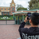 A man takes a photo on the first day of the closure of Disneyland and Disney California Adventure theme parks on March 14, 2020.